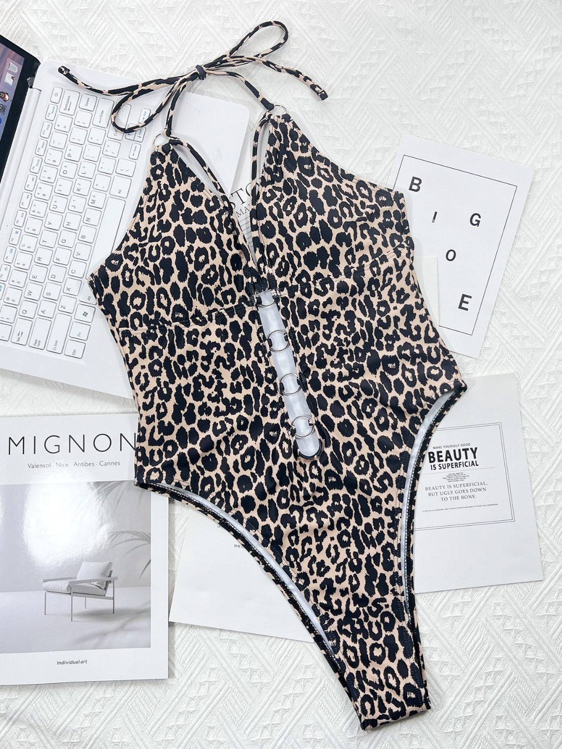 Leopard cutout halter neck swimwear laid flat back