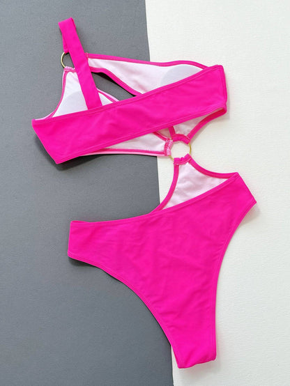 Back view flat lay of pink one-shoulder cutout swimsuit