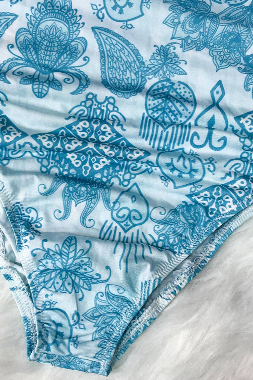 Detailed view of blue printed swimwear fabric design