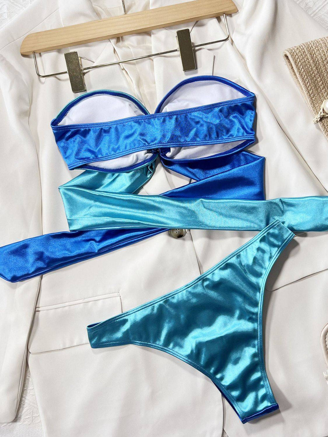 Back view of blue bikini set with ring detail on hanger