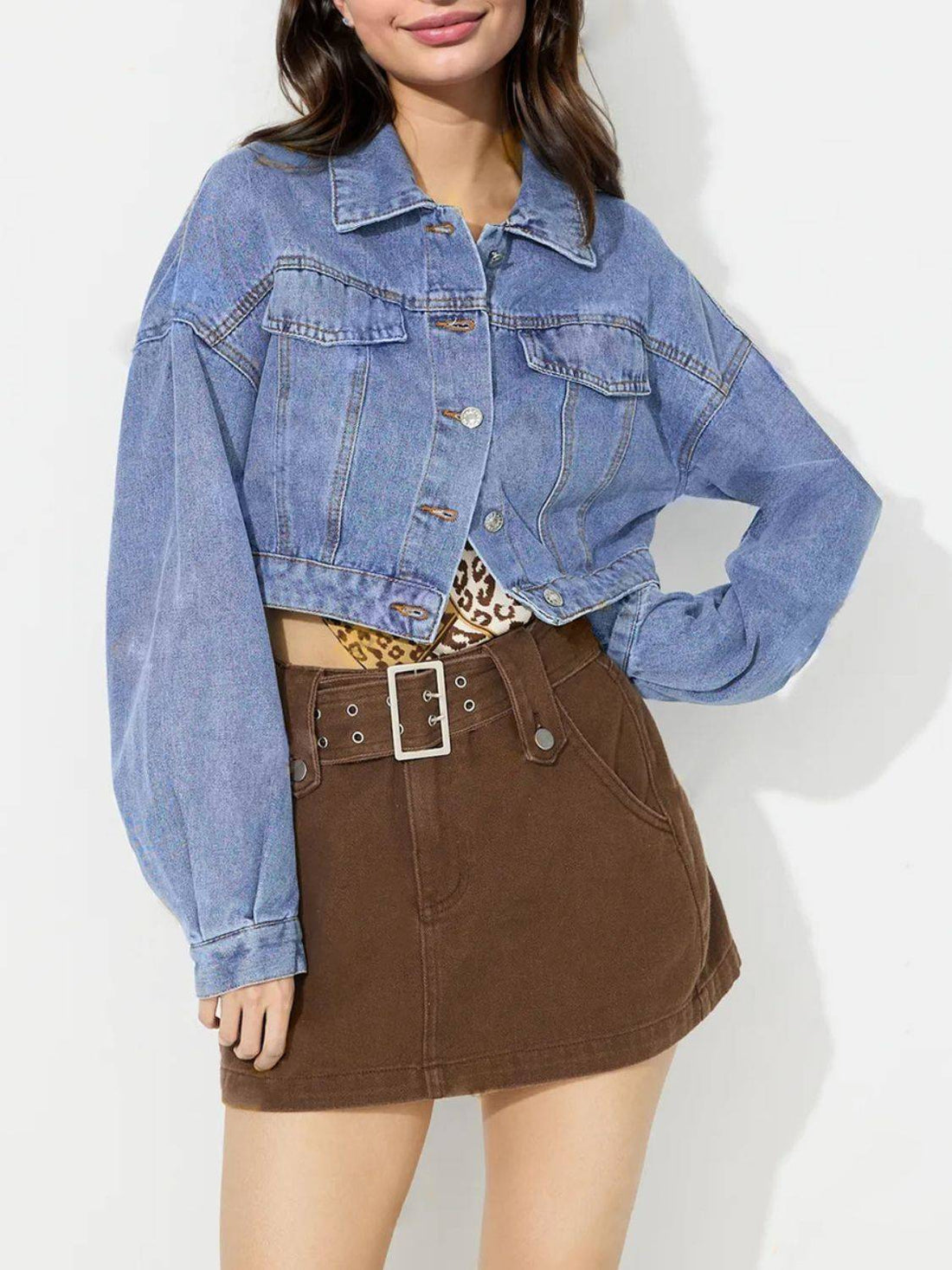 Cropped denim top with collared neck and dropped shoulders.