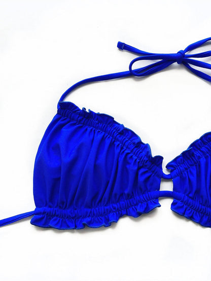 Close-up of blue bikini top with frill details