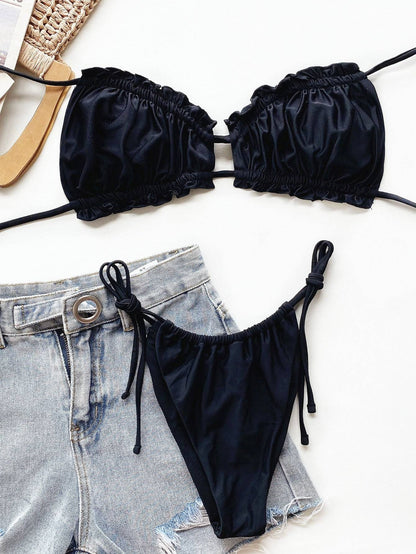 Black bikini set paired with denim shorts