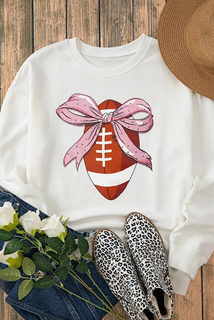 Sweatshirt with football and bow, styled with accessories