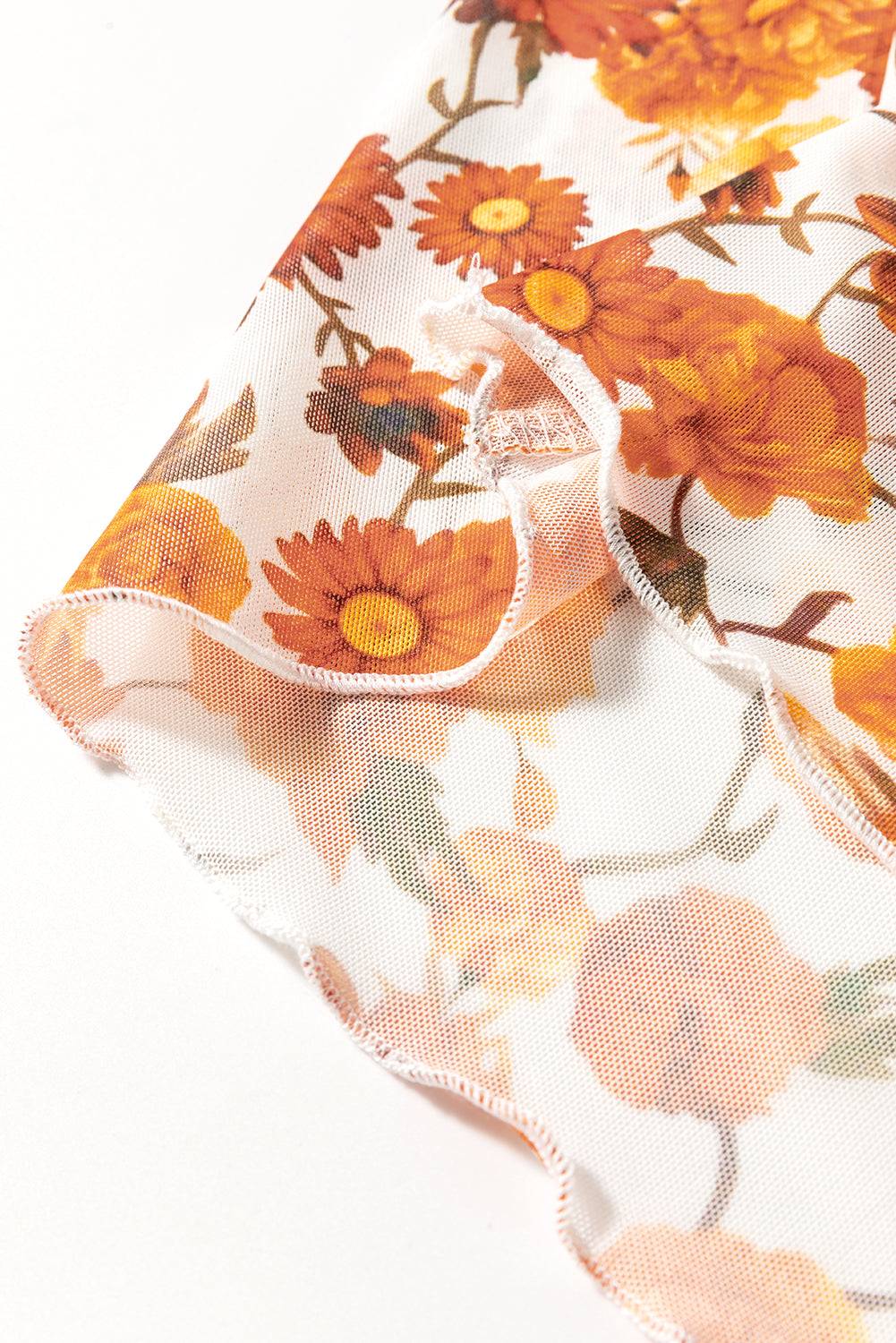 Floral pattern detail on mock neck top