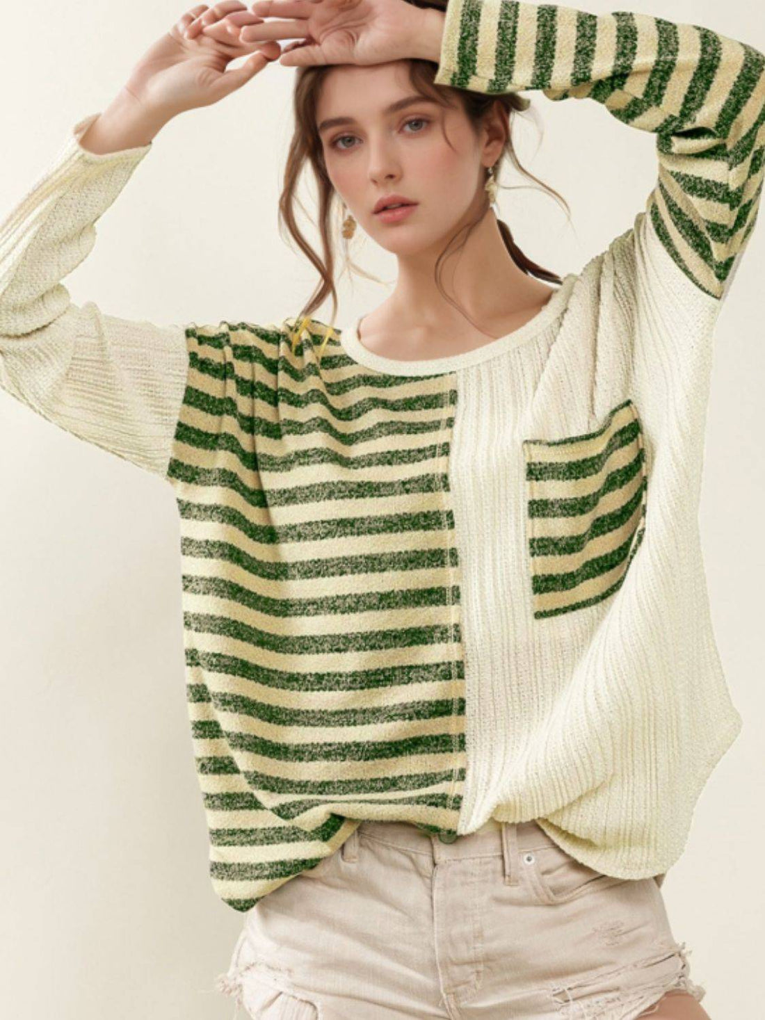 Model wearing striped round neck long sleeve top