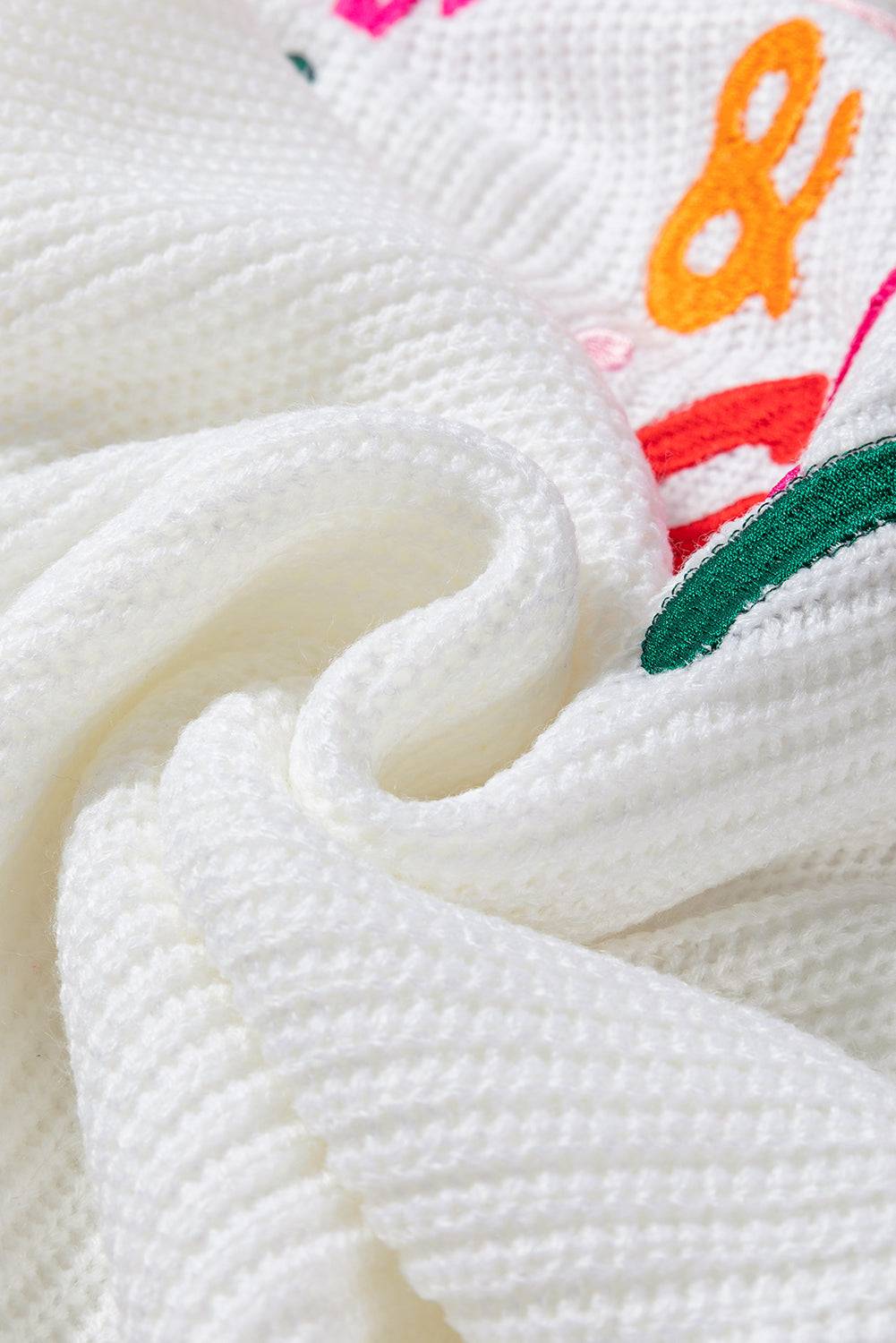 Close-up of white ribbed sweater fabric