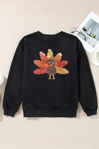 Flat lay of black sweatshirt with turkey graphic design