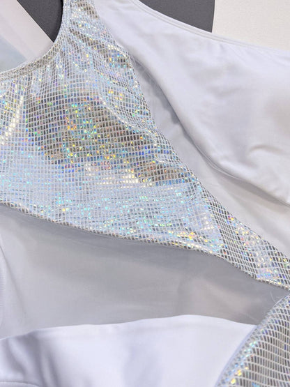 Close-up of silver panel on white swimsuit