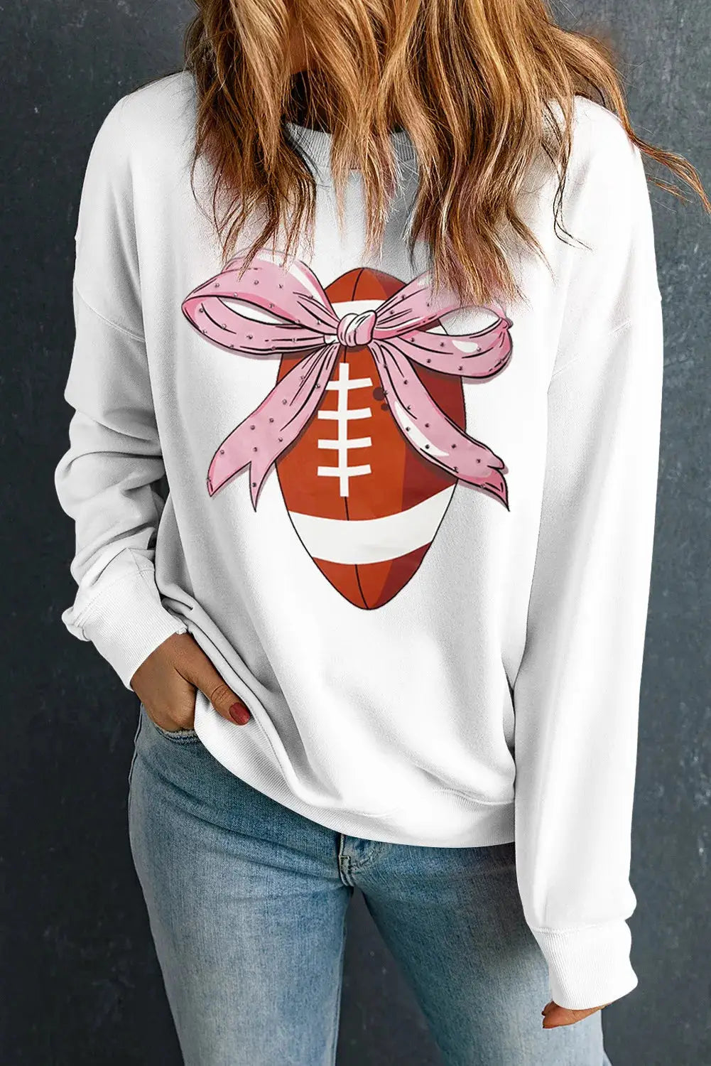 Football graphic sweatshirt with pink bow detail