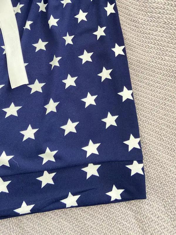 Close-up of star-patterned navy pajama shorts fabric