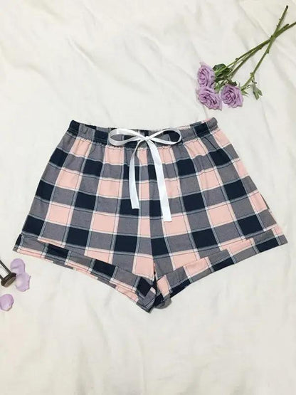 Knitted plaid pajama shorts with decorative flowers.