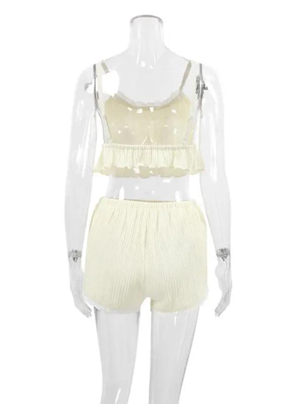 Full view of lace pajamas set on mannequin