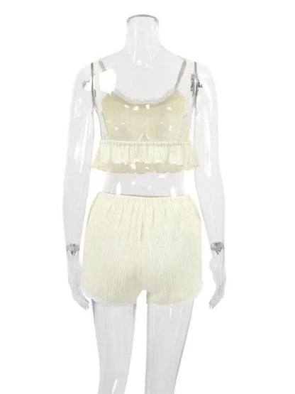 Full view of lace pajamas set on mannequin