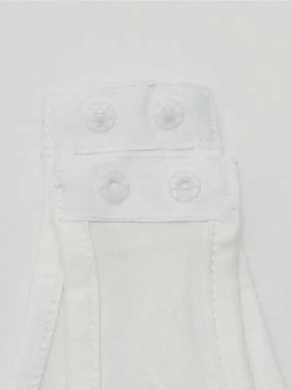 White snap closure detail on jumpsuit