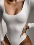 White slim long-sleeved jumpsuit with scoop neckline