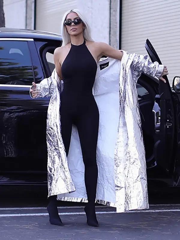 Black jumpsuit with silver coat, car background