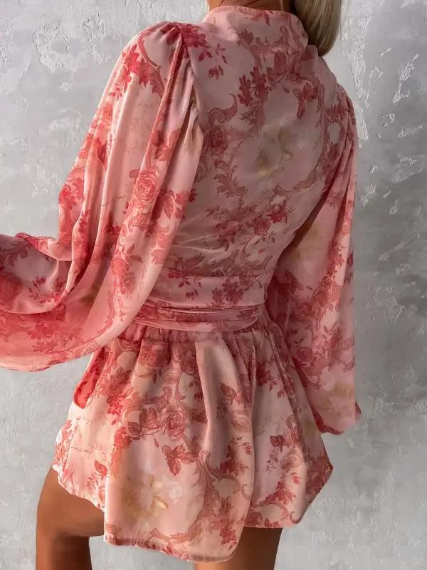 Sitting in floral print V-neck jumpsuit