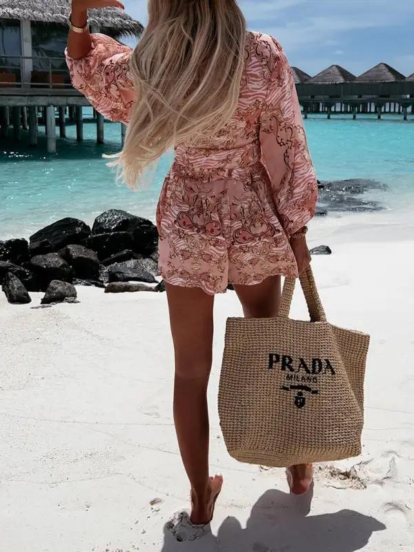 Beach scene with floral long-sleeved jumpsuit