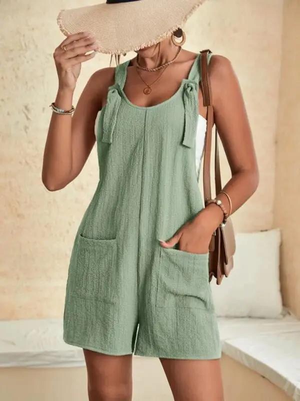 Green casual overalls with patch pockets and lace-up detail