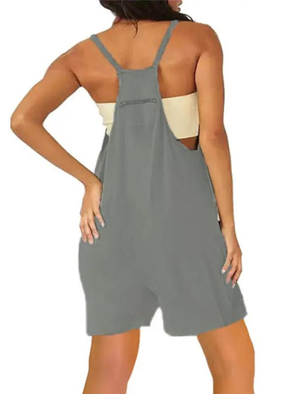 Back view of green zipper pocket suspenders jumpsuit overalls