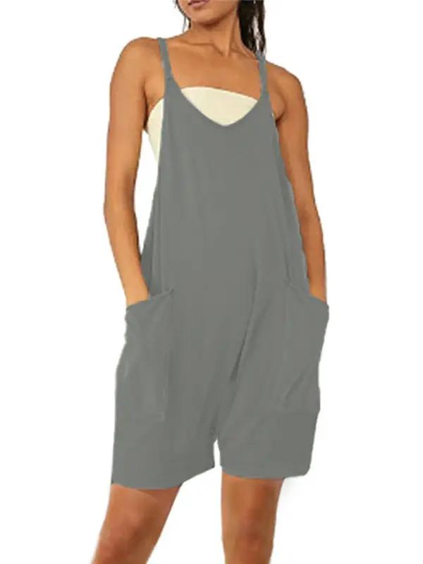 Front view of green zipper pocket suspenders jumpsuit overalls