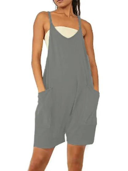 Front view of green zipper pocket suspenders jumpsuit overalls