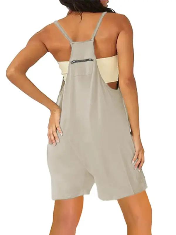 Back view of beige zipper pocket suspenders jumpsuit overalls