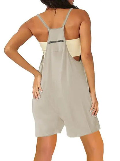 Back view of beige zipper pocket suspenders jumpsuit overalls
