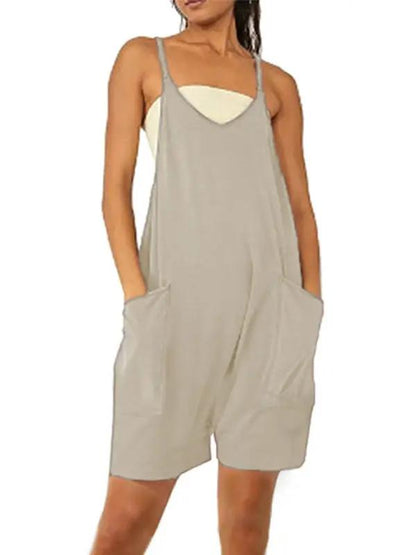 Front view of beige zipper pocket suspenders jumpsuit overalls