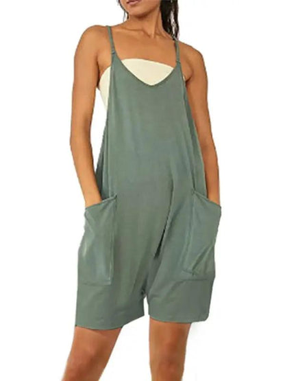 Front view of green zipper pocket suspenders jumpsuit overalls