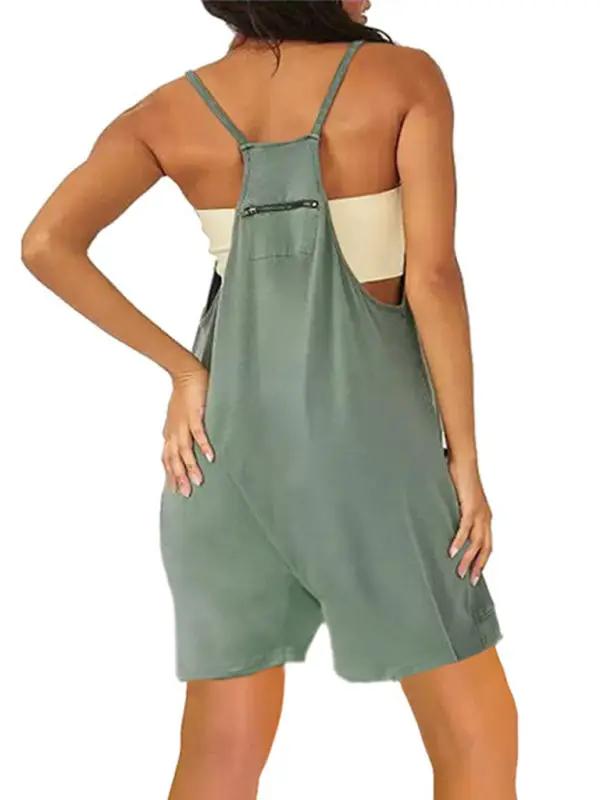 Back view of green zipper pocket suspenders jumpsuit overalls