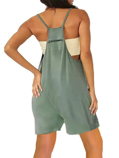 Back view of green zipper pocket suspenders jumpsuit overalls