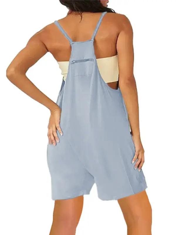 Back view of blue zipper pocket suspenders jumpsuit overalls