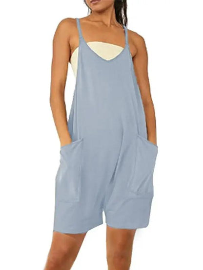 Front view of blue zipper pocket suspenders jumpsuit overalls
