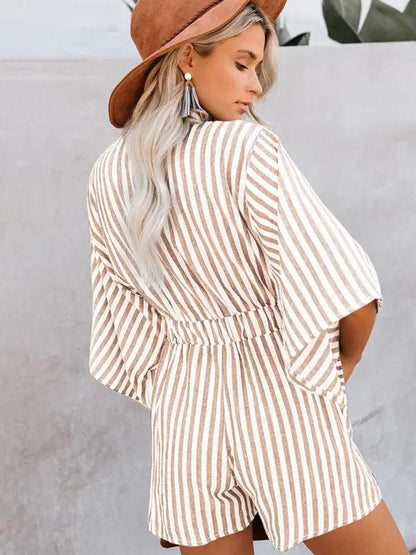 Back view of brown striped jumpsuit with trumpet sleeves