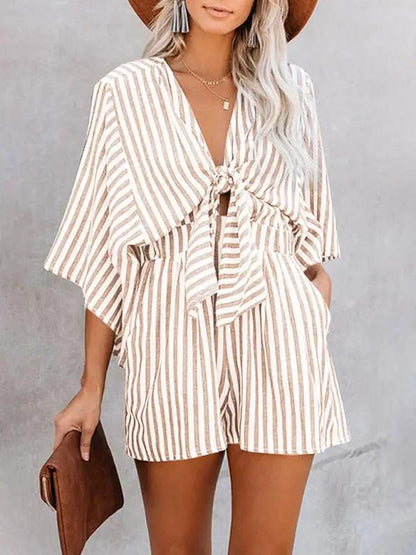 Brown striped jumpsuit with deep V and trumpet sleeves
