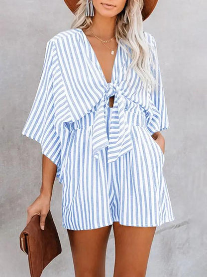 Blue striped jumpsuit with deep V and trumpet sleeves