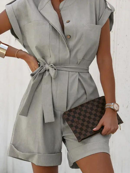 Close-up of gray linen cotton jumpsuit with buttons