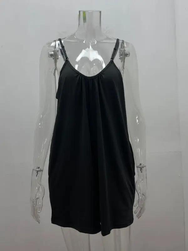Black loose pocket jumpsuit on mannequin, front view