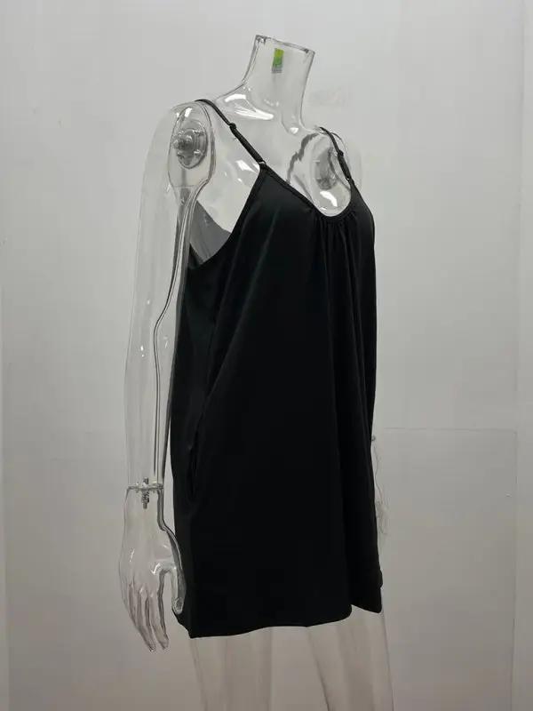 Side view of black loose pocket jumpsuit on mannequin