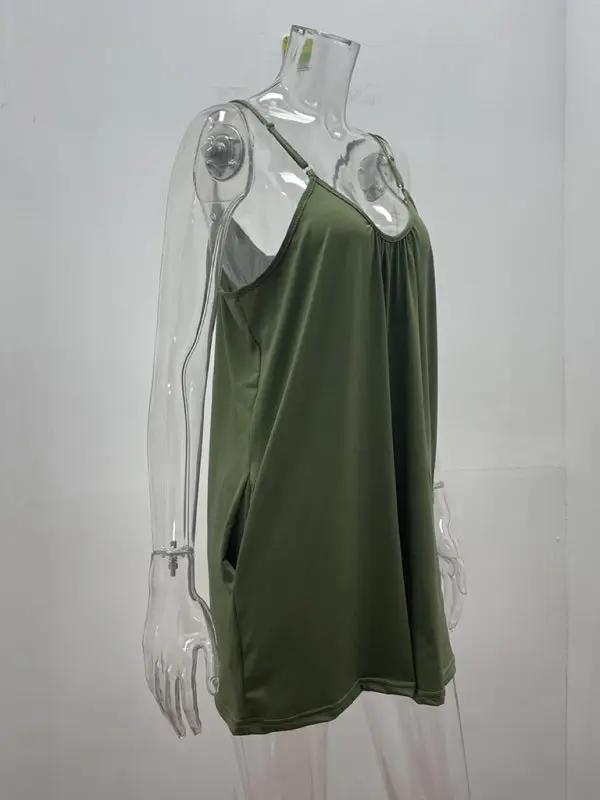 Side view of green loose pocket jumpsuit on mannequin
