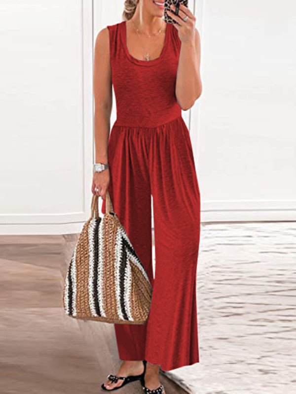 Red sleeveless loose jumpsuit with a woven bag