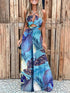Blue leaf print sling jumpsuit with cutout design