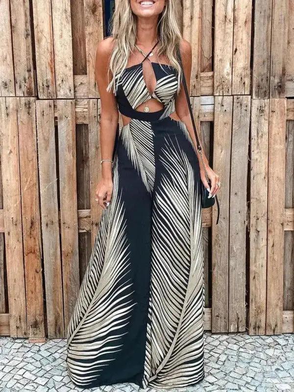 Black and beige palm print sling jumpsuit with cutout