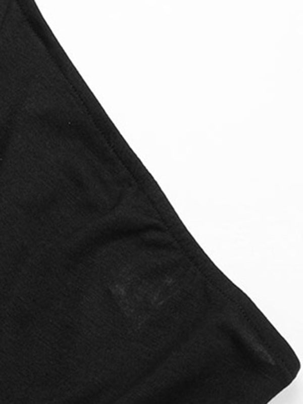 Close-up of black fabric on jumpsuit