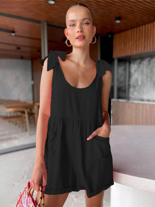 Woman wearing black bow knot pocket jumpsuit