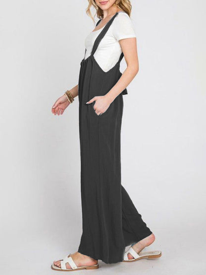 Side view of black wide-leg jumpsuit with lace-up