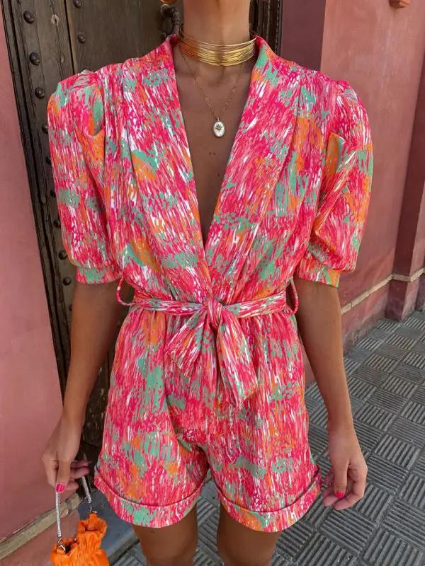 Vibrant printed jumpsuit with deep V-neck and bubble sleeves