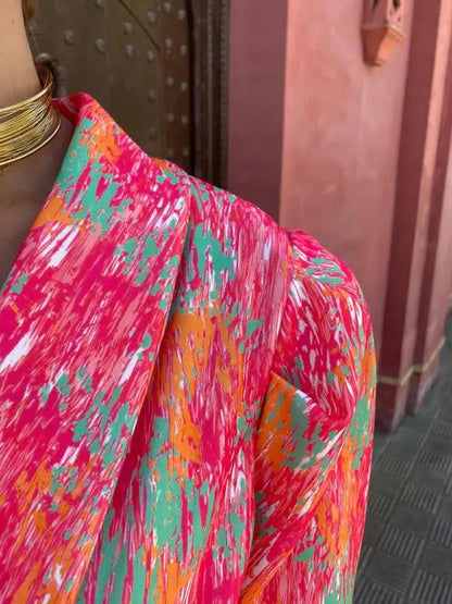 Close-up of colorful printed fabric on jumpsuit